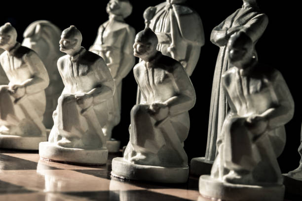 istock Chess board. Beautiful white hand-made pawns among allied chess 1130588770