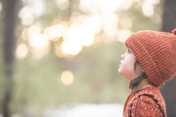 istock Little girl looking up 1130592191