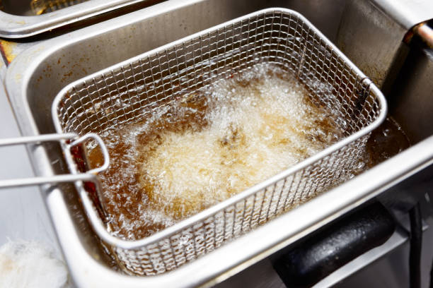 istock Deep frying some food in restaurant kitchen 1130592400