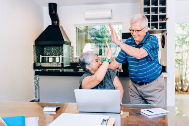 istock Senior couple cheering an achievement 1130598003
