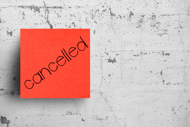 Sticky note on concrete wall, Cancelled Sticky note on concrete wall, Cancelled cancellation photos stock pictures, royalty-free photos & images