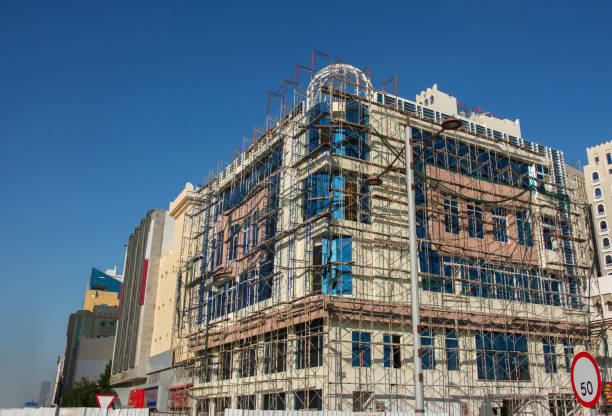 istock Building under construction is encased in scaffolding in Doha 1130603411