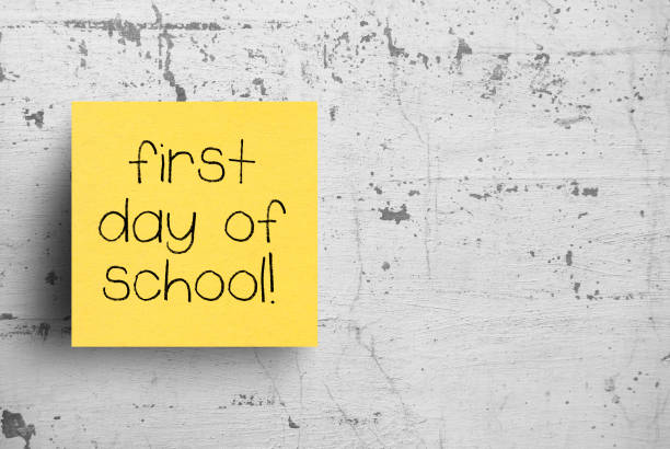 istock Sticky note on concrete wall, First day of school 1130608887