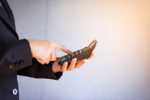 istock Business young woman using calculator for calculating financial expense at office. 1130610510