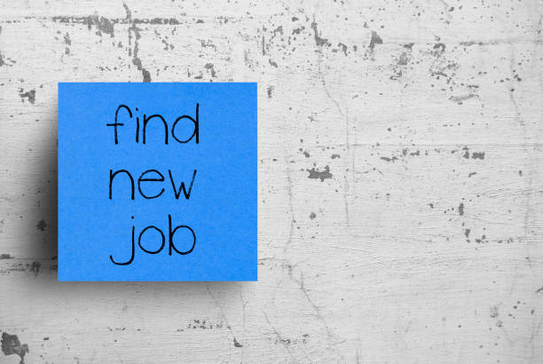 istock Sticky note on concrete wall, Find new job 1130610642