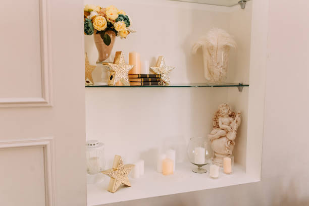 istock candles, books and figurines on the shelves 1130610865