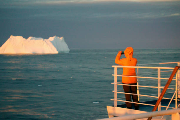 istock Women take pictures on an Antarctic ship 1130610927