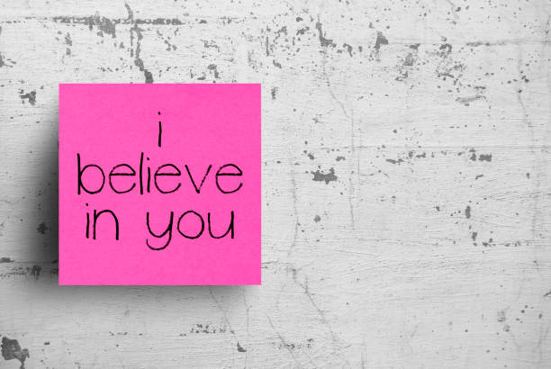 istock Sticky note on concrete wall, i believe in you 1130612735