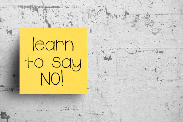 istock Sticky note on concrete wall, Learn to say No 1130617012