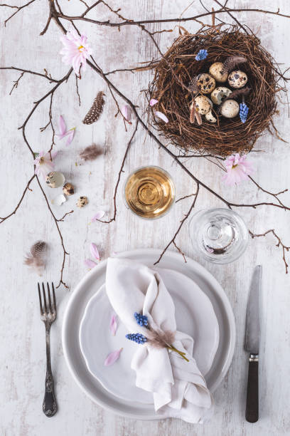 istock Table decoration for Easter with Plates, Covers, Bird's Nest. Happy Easter 1130618319