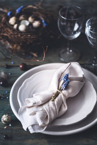 istock Table decoration for Easter with Plates, Covers, Bird's Nest. Happy Easter 1130618332