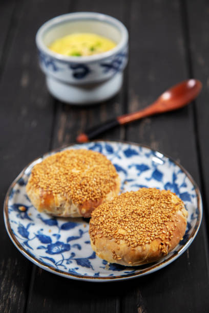 istock Chinese traditional sesame flaky pastry and  steamed egg custard 1130618570
