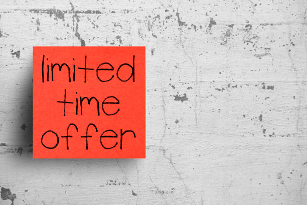 istock Sticky note on concrete wall, Limited time offer 1130620725