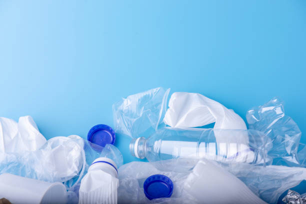 istock Used clean plastic garbage in a pile. Bottles and bags on blue background. Environmental pollution and waste sorting 1130620765