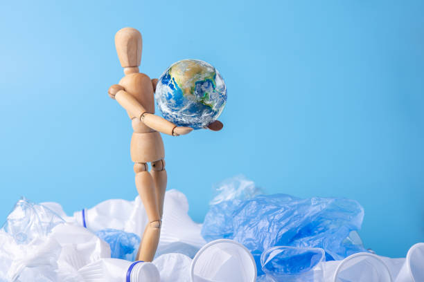 istock Man carry the planet in the hands to save the earth from garbage and plastic. Elements furnished by NASA 1130620806