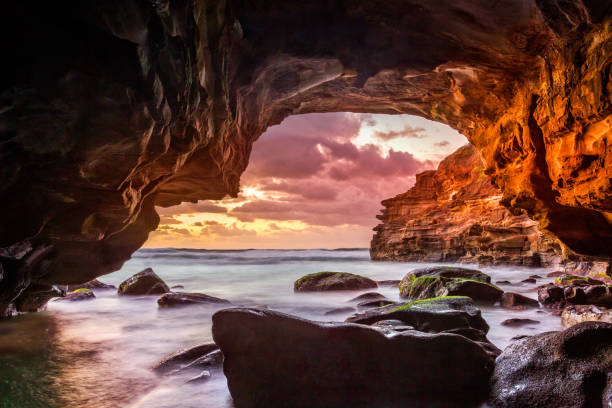 istock Sunrise views from inside a sea cave 1130625334