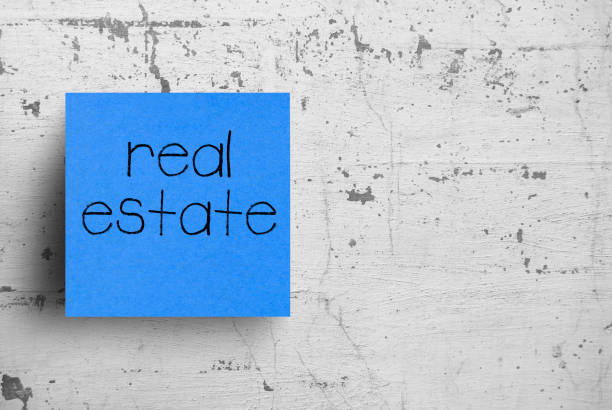 istock Sticky note on concrete wall, Real Estate 1130626447