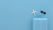 Suitcase, Minimal Travel Concept with blue background