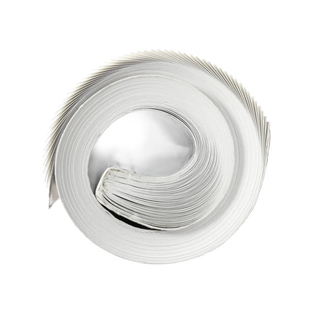 Rolled Up Book Close-up top view of a rolled up book on white background. rolled up magazine stock pictures, royalty-free photos & images