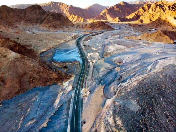 istock Desert road in the mountains aerial view 1130629766