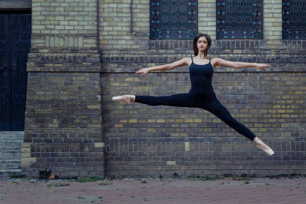 istock Young ballet dancer on the street taking art performance 1130630396
