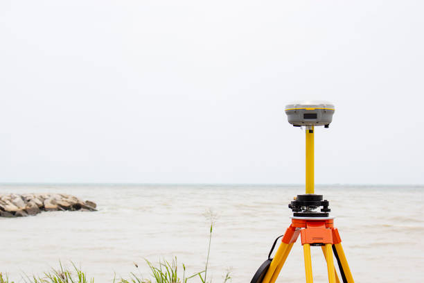 GPS surveying in field sea background, Global Positioning System.