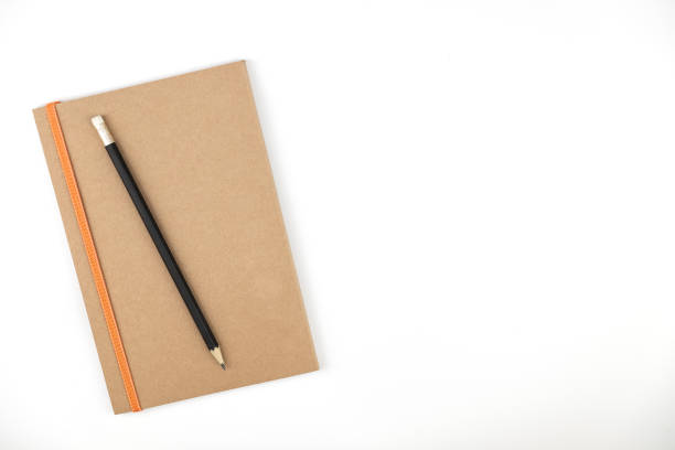 istock Book and pencil on white isolated background copy space, top veiw background 1130631662