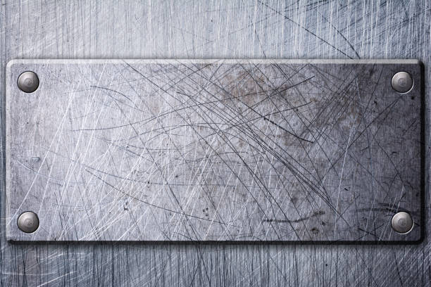 istock Gray grunge scratched metallic texture background with nameplate 1130632435