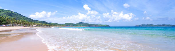 istock Beautiful amazing gold colored sandy beach with soft waves isolated with sunny blue sky. Concept of tropical calm tourism idea, copy space, close up 1130632472