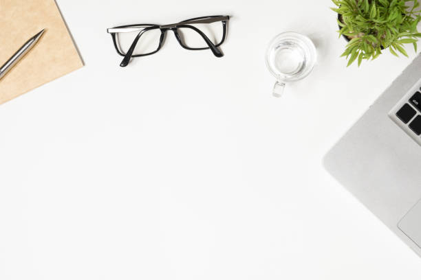 istock White office desk table with a lot of things on it. Top view with copy space, flat lay. 1130633103