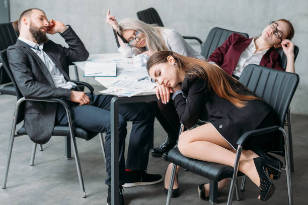 istock tired corporate personnel sleep desk overworking 1130633930
