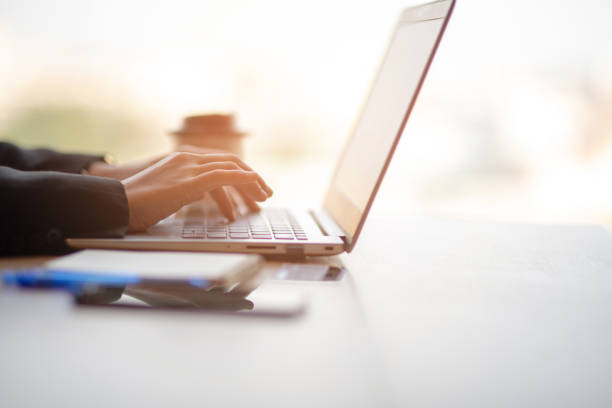 istock Women sitting at work typing at the office desk 1130634006