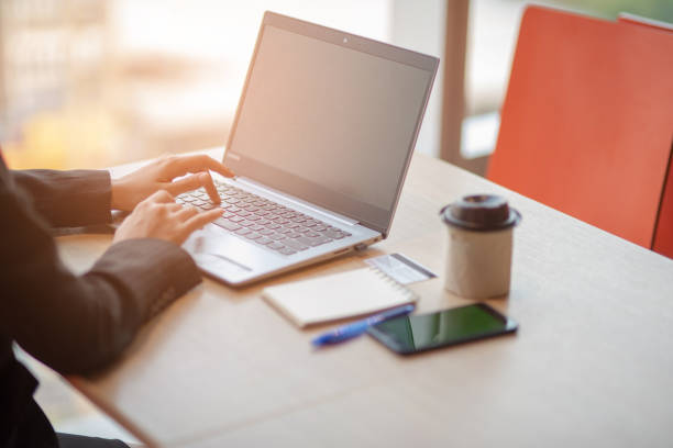 istock Women sitting at work typing at the office desk 1130634049