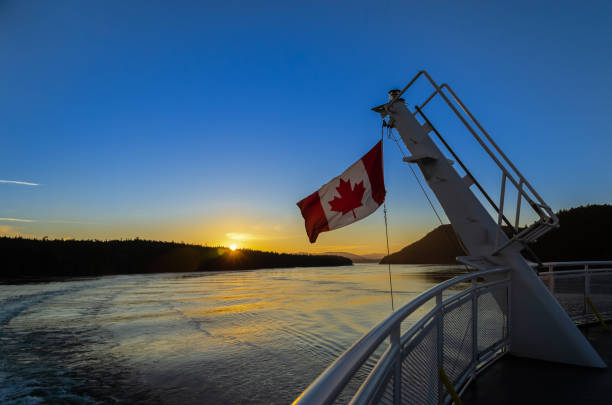 istock Canadian flag on a ferry at sunset 1130636226