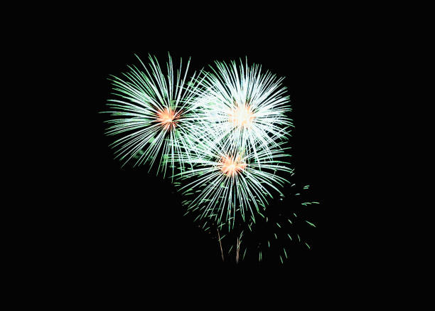 Colorful fireworks explosion in festive celebration, isolated on black background