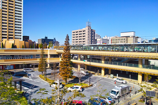 Scenery of Ichikawa station south exit of Chiba prefecture. There is a taxi and a car roundabout in front of the station.