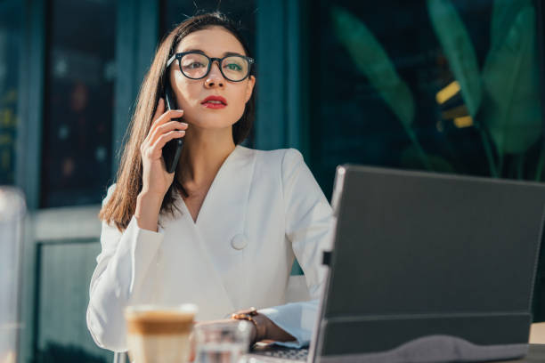 istock Stylish young woman talking on mobile phone 1130639068