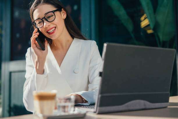 istock Charming businesswoman talking on phone 1130641775