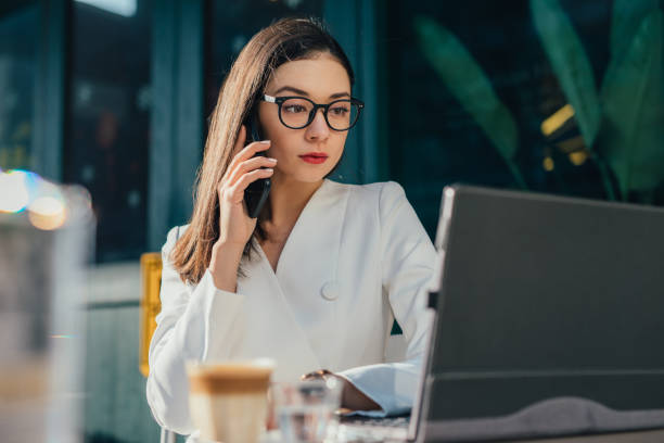 istock Serious businesswoman using mobile phone 1130641825