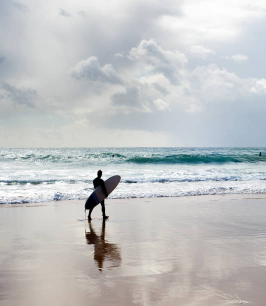istock Surfer surfboard walking beach Portugal 1130642713