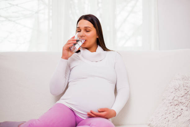 istock Pregnant woman at home 1130644581