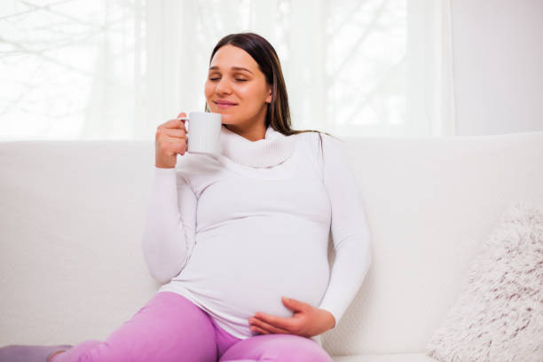 istock Pregnant woman at home 1130644596