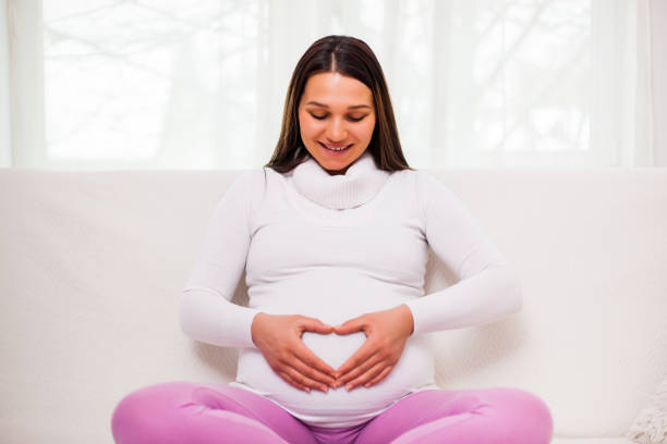 istock Pregnant woman at home 1130644796