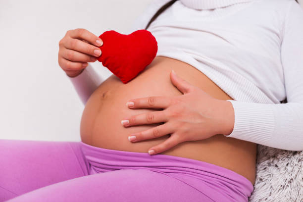 istock Pregnant woman at home 1130645921