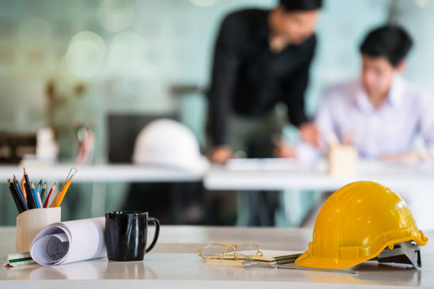 istock Architects,engineer team discussing together on a blueprint for a new construction project in the office. Architects,engineer workplace concept 1130646117