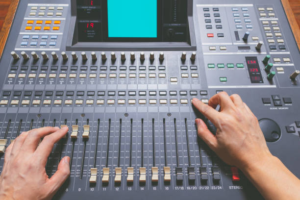 istock sound engineer hands working on sound mixing console in recording studio. music production, broadcasting concept 1130646999