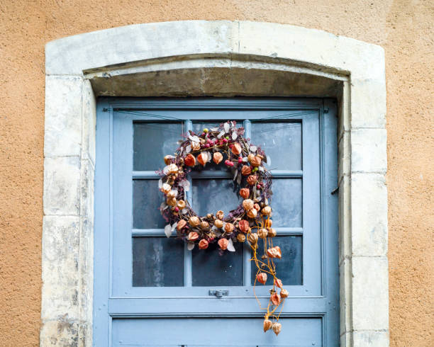 istock Front view of a Christmas crown on a glazed Dutch door. 1130647292