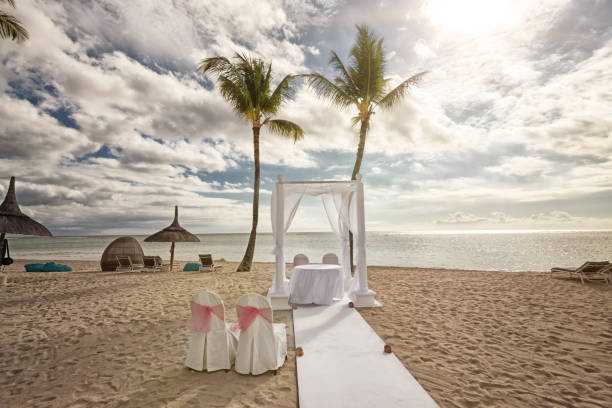 istock Two chairs ready for wedding ceremony on tropical island 1130647869