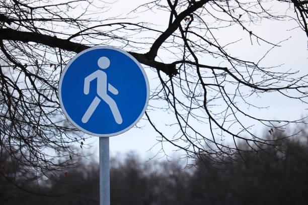 istock Pedestrian walking lane road sign 1130650042