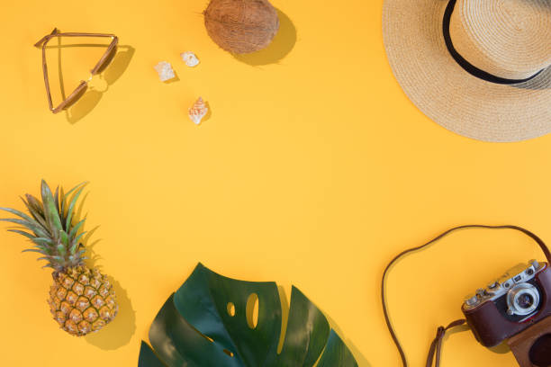 istock Summer vacation flat lay concept on yellow background. Tropical accessories top view. Space for text. 1130650843